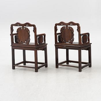 A pair of hardwood armchairs, China, late Qing dynasty/around 1900.