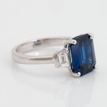 A platinum ring set with a step-cut sapphire weight 4.58 cts.