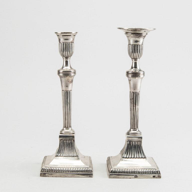 A pair of silver candle sticks around 1800 possibly Portugal, weight ca 734 gr, height ca 23 cm.