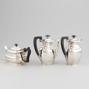 A silver teapot, coffee pot and a hot water pot, including Atkins Brothers, Sheffield 1944.