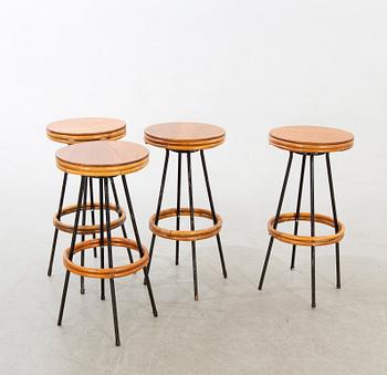 A set of four mid 20th century bar stools.
