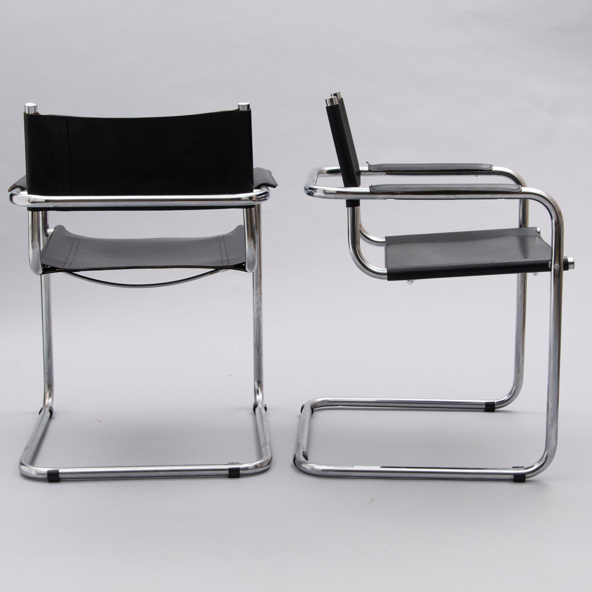 A Set of Three Chrome and Black Leather Chairs.