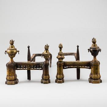 A pair of 19th century Louis XVI style cast iron and brass andirons.