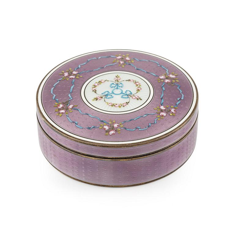 A German 19th century silver gilt and enamel guilloche box with lid.