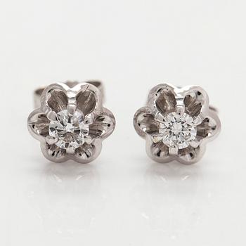 A pair of 18K white gold earrings set with round brilliant-cut diamonds.
