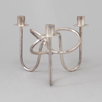 Josef Frank, a silver platen "Vänskapsknuten" candelabra ju Josef Frank för Firma Svenskt Tenn.