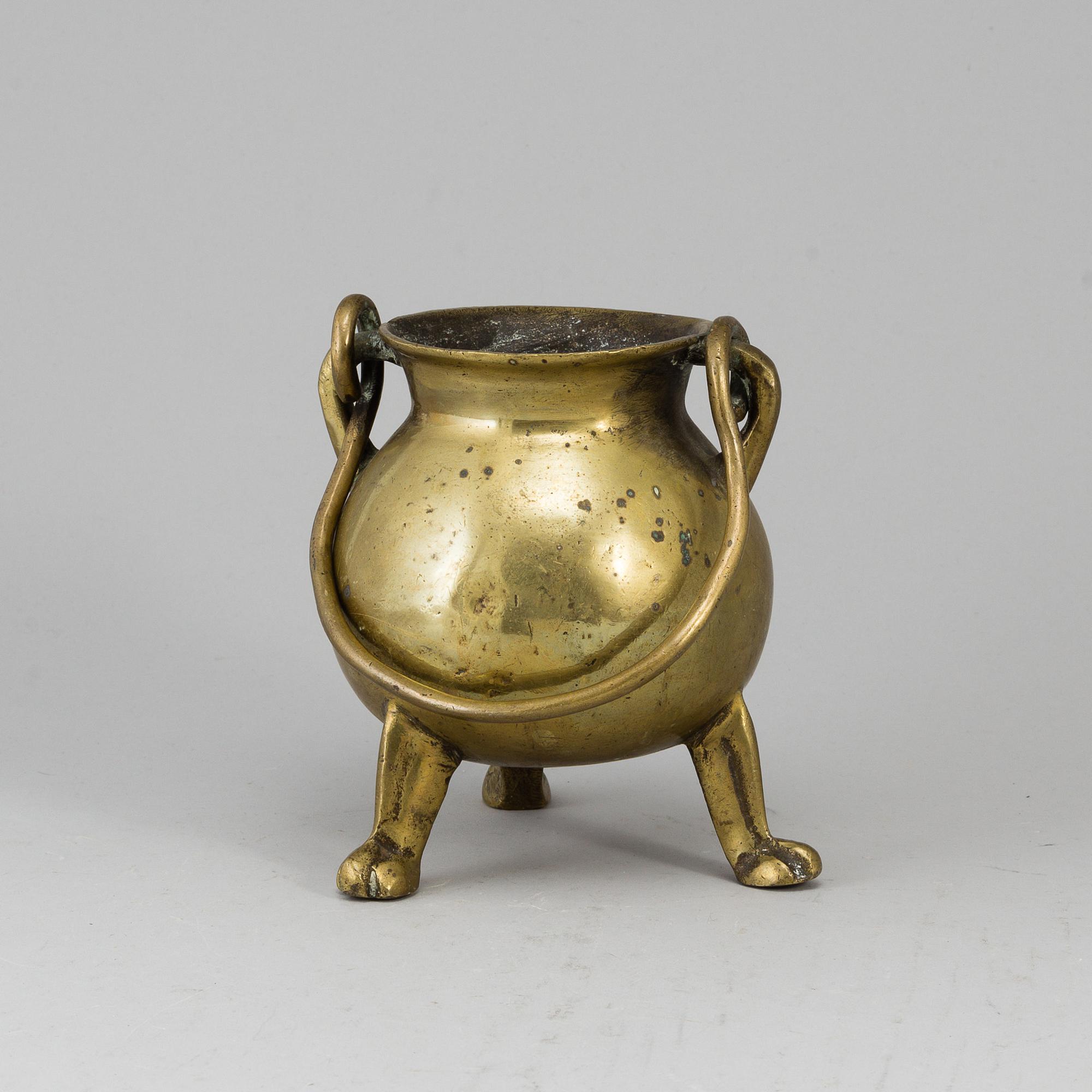 A 17th century brass bowl.