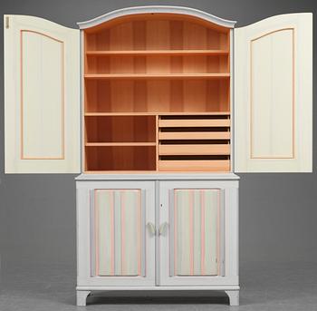 A Carl Malmsten cabinet, "Stigberget", with carved and painted decoration of flowers in colours.