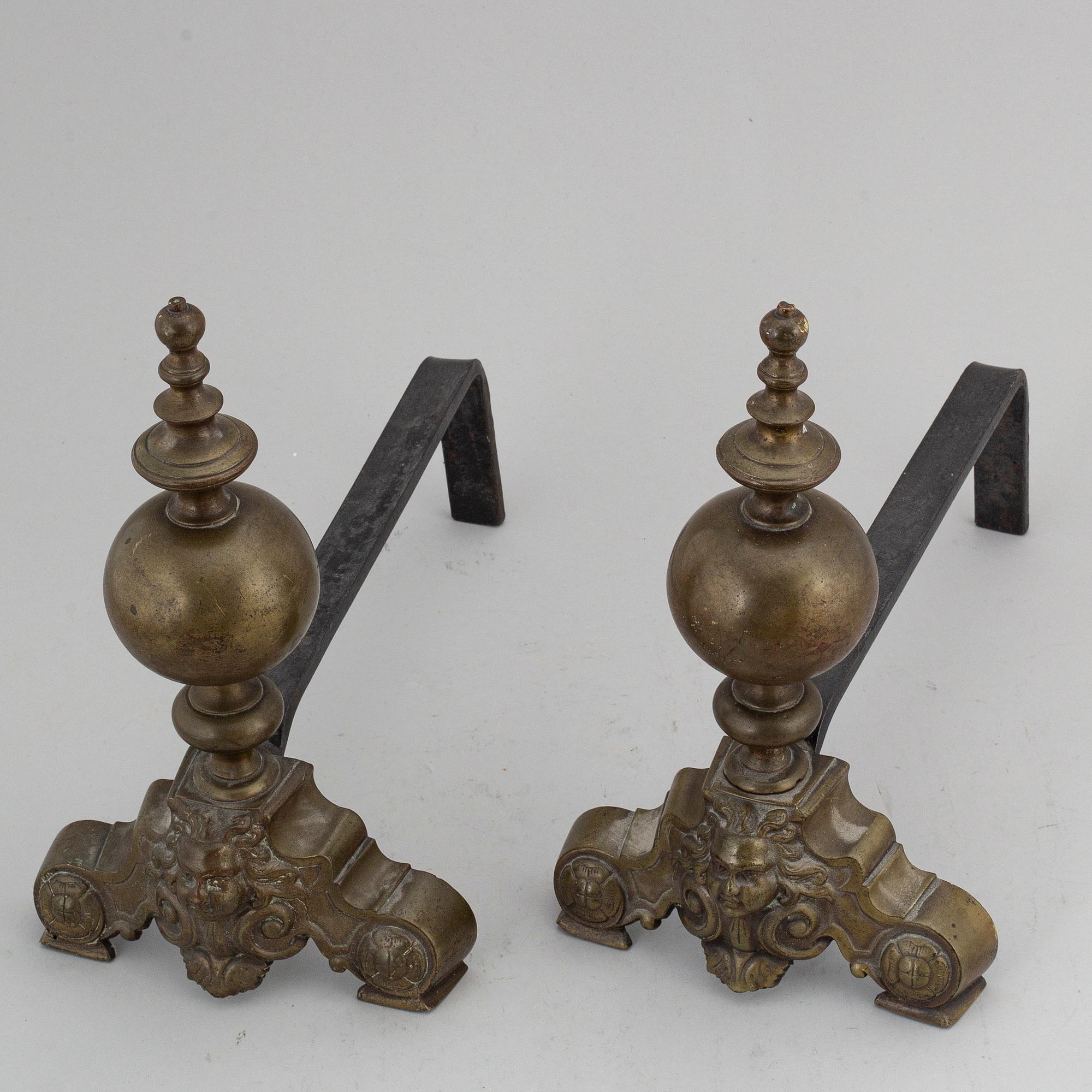 A pair of Louis XVI-style brass andirons.