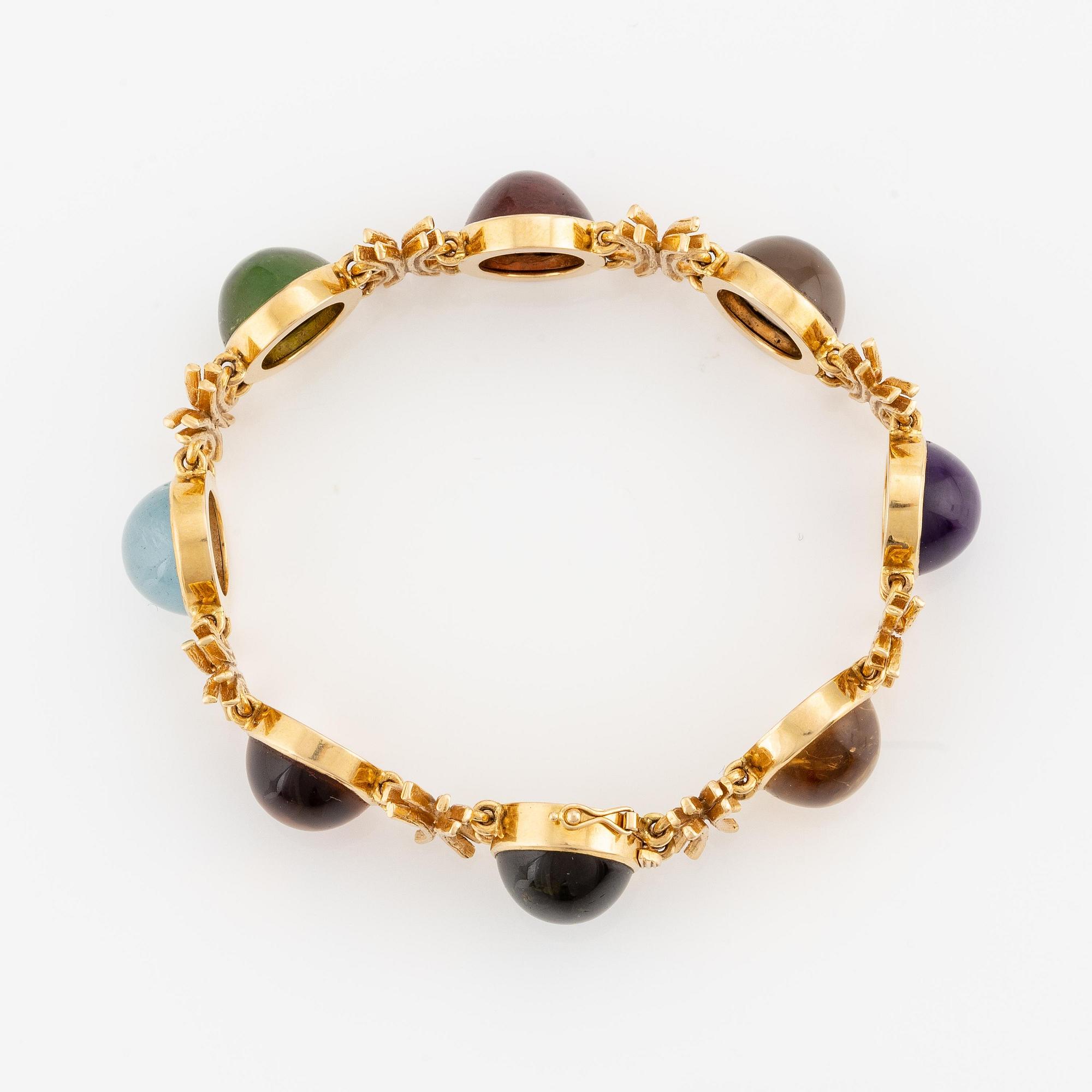 W.A. Bolin, design Barbro Littmarck, armband, 18K guld med cabochonslipade färgstenar, Stockholm 1970.