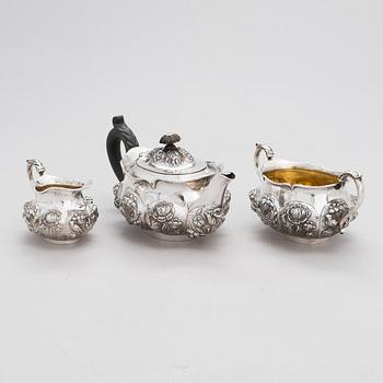 An English 3-piece sterling silver tea set, maker's mark of William Comyns & Sons, London 1892.