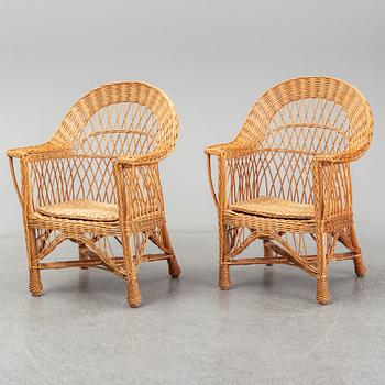 A pair of 1970s/1980s rattan armchairs.