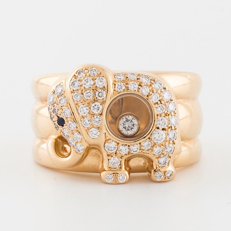 CHOPARD, a "Happy Diamonds" brilliant cut diamond and sapphire ring.