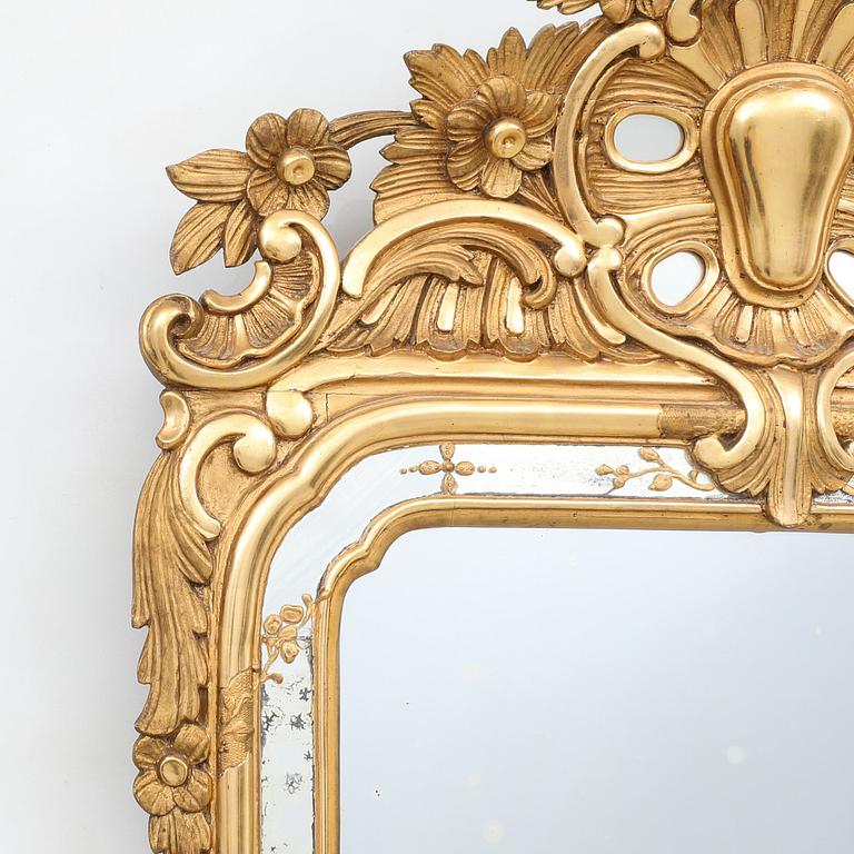 Rococo-style mirror dated 1919.