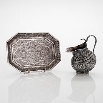 An Indian silver cream jug, and a filigree silver dish, presumably first half of the 20th century.