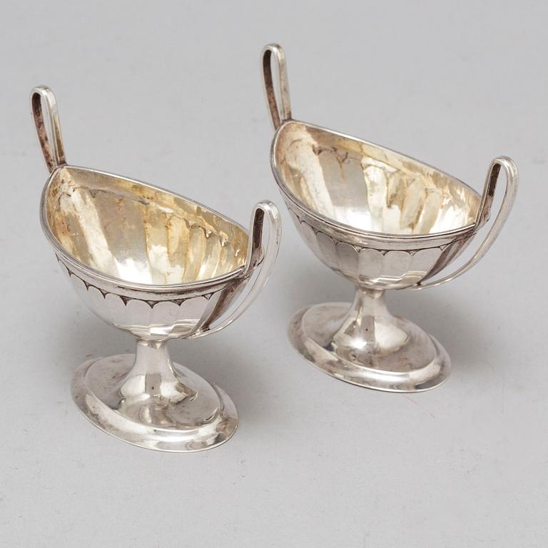 A pair of parcel-gilt empire silver salt cellars, 19th century.