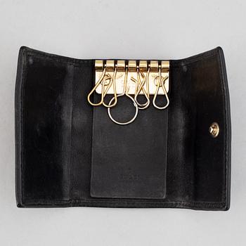Gucci, ipad-case, key-case and mobile-case.