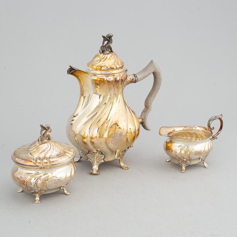 A silver coffee pot, creamer and sugar bowl, CG Hallberg, Stockholm 1944-45.