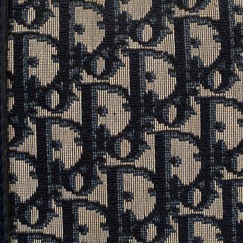 Christian Dior, a canvas handbag, toilet bag and key holder.