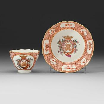67. A export cup and saucer with a crowned cartush and monogram in famille rose, Qing dynasty Qianlong (1736-1795).