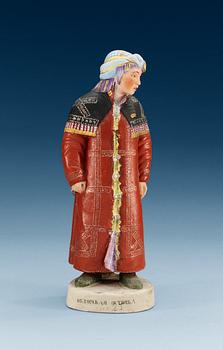 1355. A Russian bisquit figure depicting a Khanty woman, Gardner ca 1924.