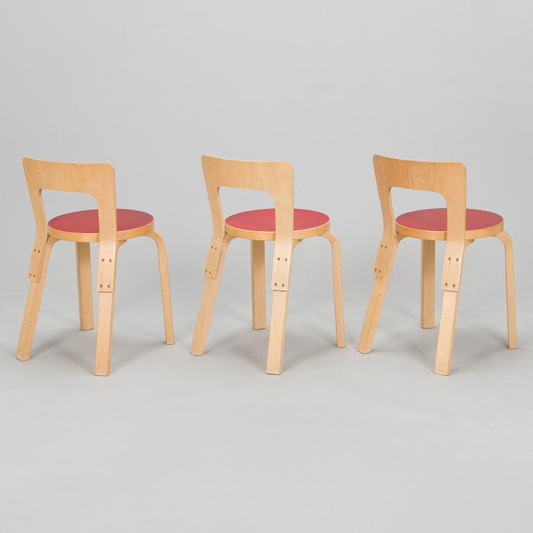 Alvar Aalto, A mid-20th century drop leaf table and three chairs for O.Y. Huonekalu-ja Rakennustyötehdas A.B.