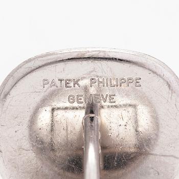 Patek Philippe, a pair of 18K whitegold 'Calatrava' cufflinks.