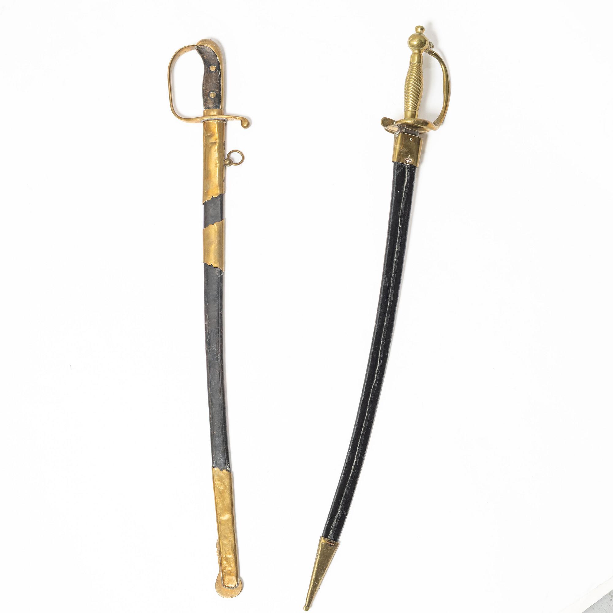 A Swedish police sabre and cutlass, with scabbards.