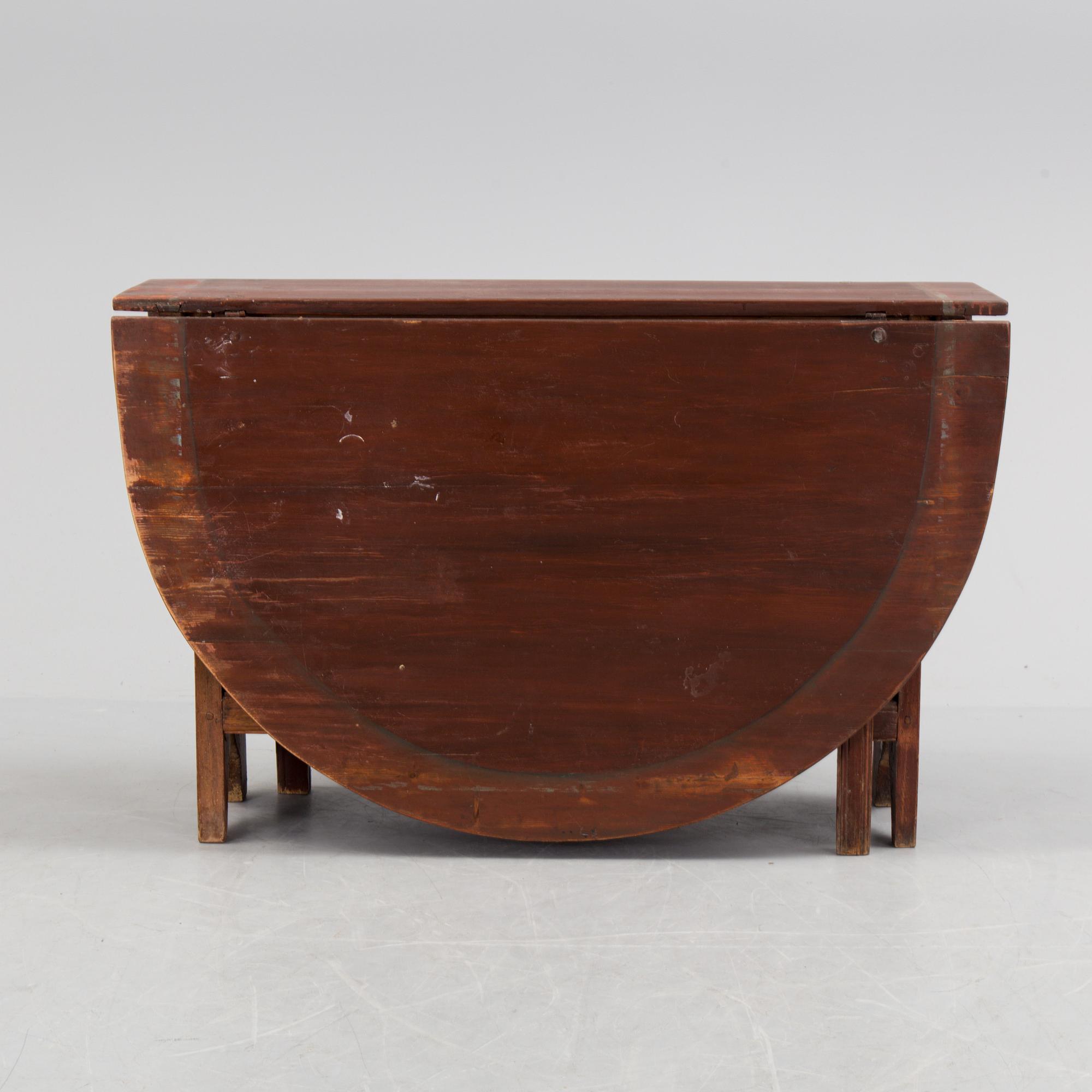 A 19th century painted flap table.