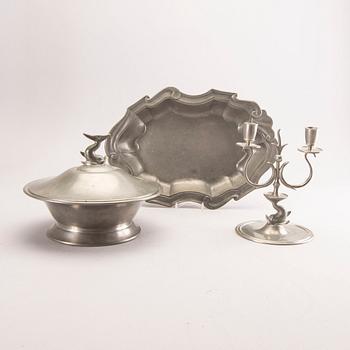 A pewter bowl with lid, a candelabra and a tray from Firma Svenskt Tenn 1927, 1930 and 1960.