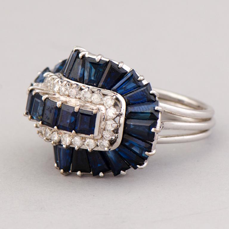 A RING, baguette cut sapphires, brilliant cut diamonds, 14K white gold.