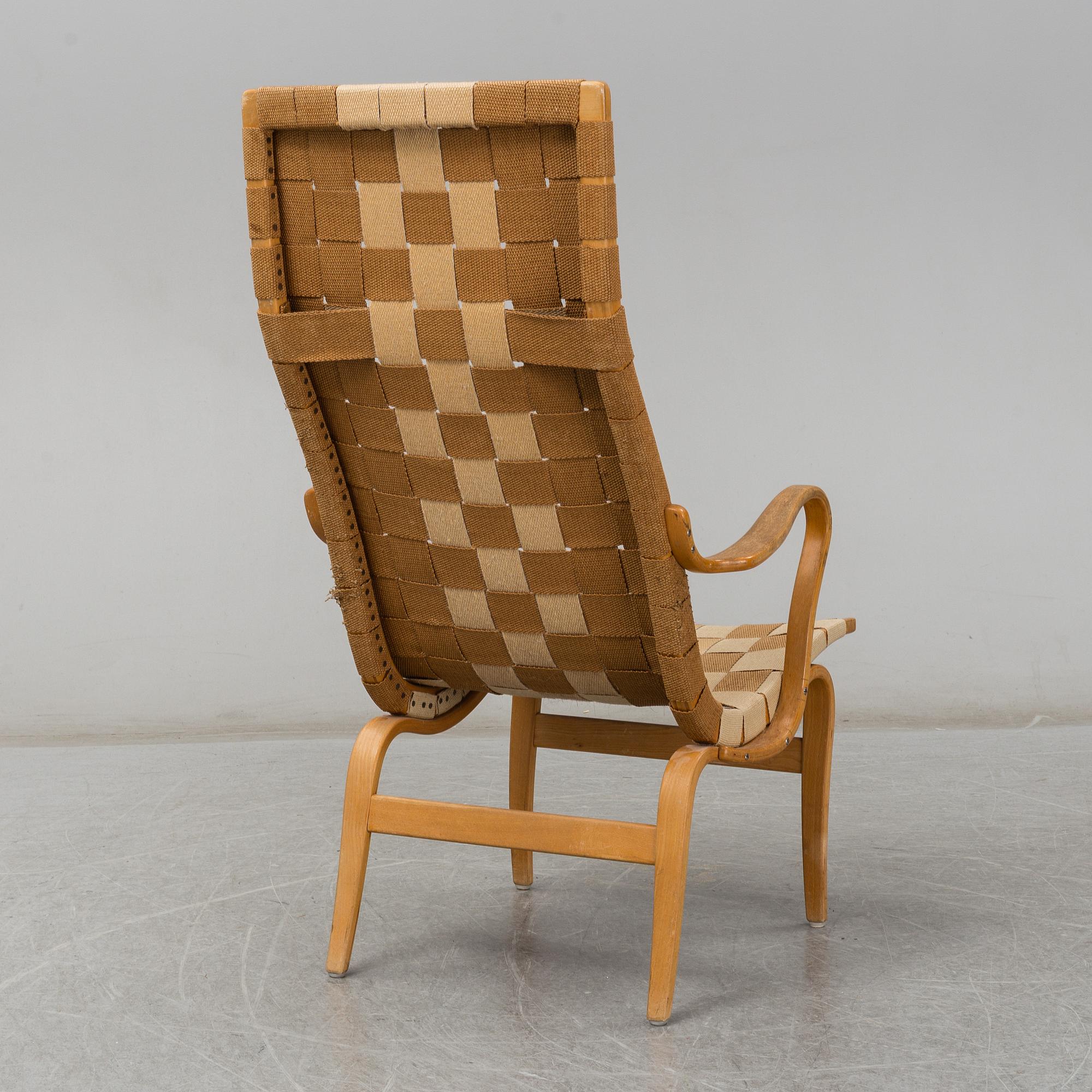 A armchair, model "Eva hög", designed by Bruno Mathsson for Firma Karl Mathsson, dated 1941.