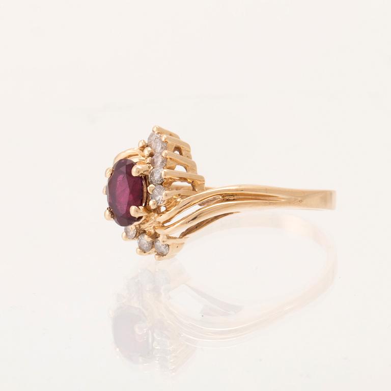 A 14K gold ring set with an oval faceted synthetic ruby and round brilliant-cut diamonds.