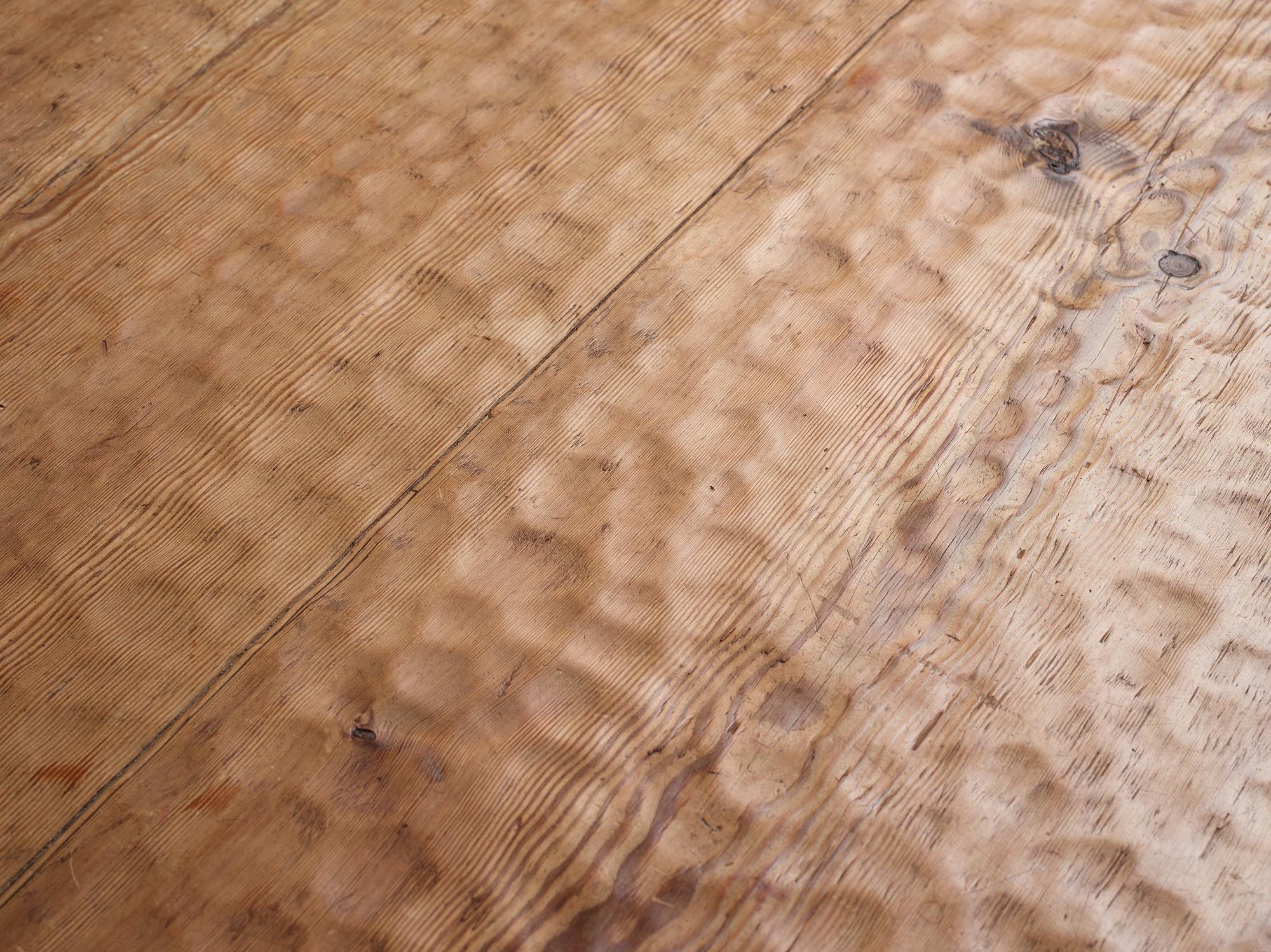 Gustaf Fjaestad, an Art Nouveau carved pine table, Arvika Sweden 1914, a double to the table in the Thiel Collection,