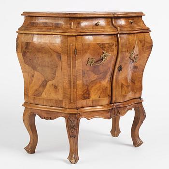 An Italian Louis XV-style bombé commode, later part 19th century.