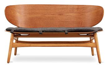 A Hans J Wegner teak and beech 'Shell' settee by Fritz Hansen, Denmark, 1950's.