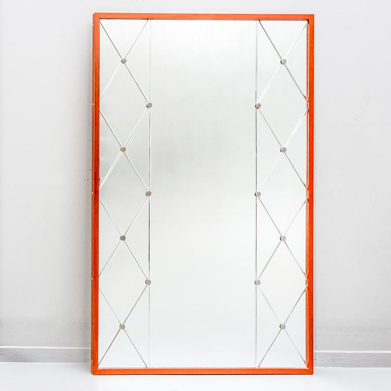 A 1960s teak mirror.