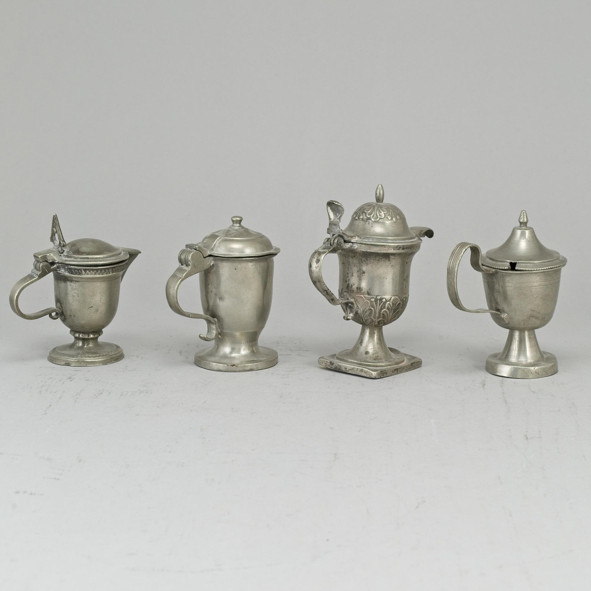Eight pewter mustard pots, 18th/19th century.