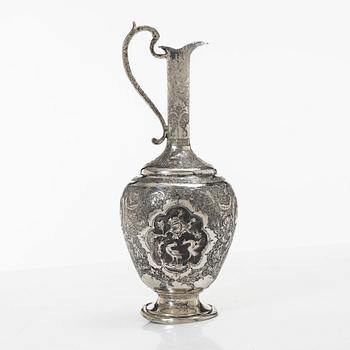 A Persian silver pitcher with five stemmed cups and a beaker, first part of the 1900s.
