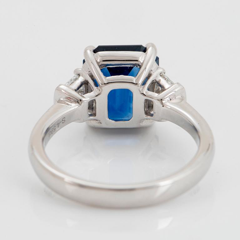 A platinum ring set with a step-cut sapphire weight 4.58 cts.