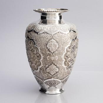 A Persian silver vase, late Qajar dynasty around 1910.