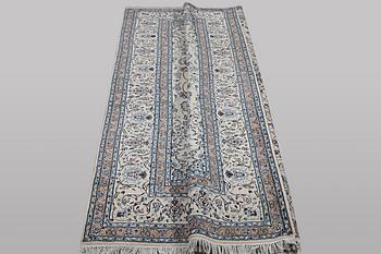 A carpet, Nain, part silk, 9 laa, c. 307 x 203 cm.