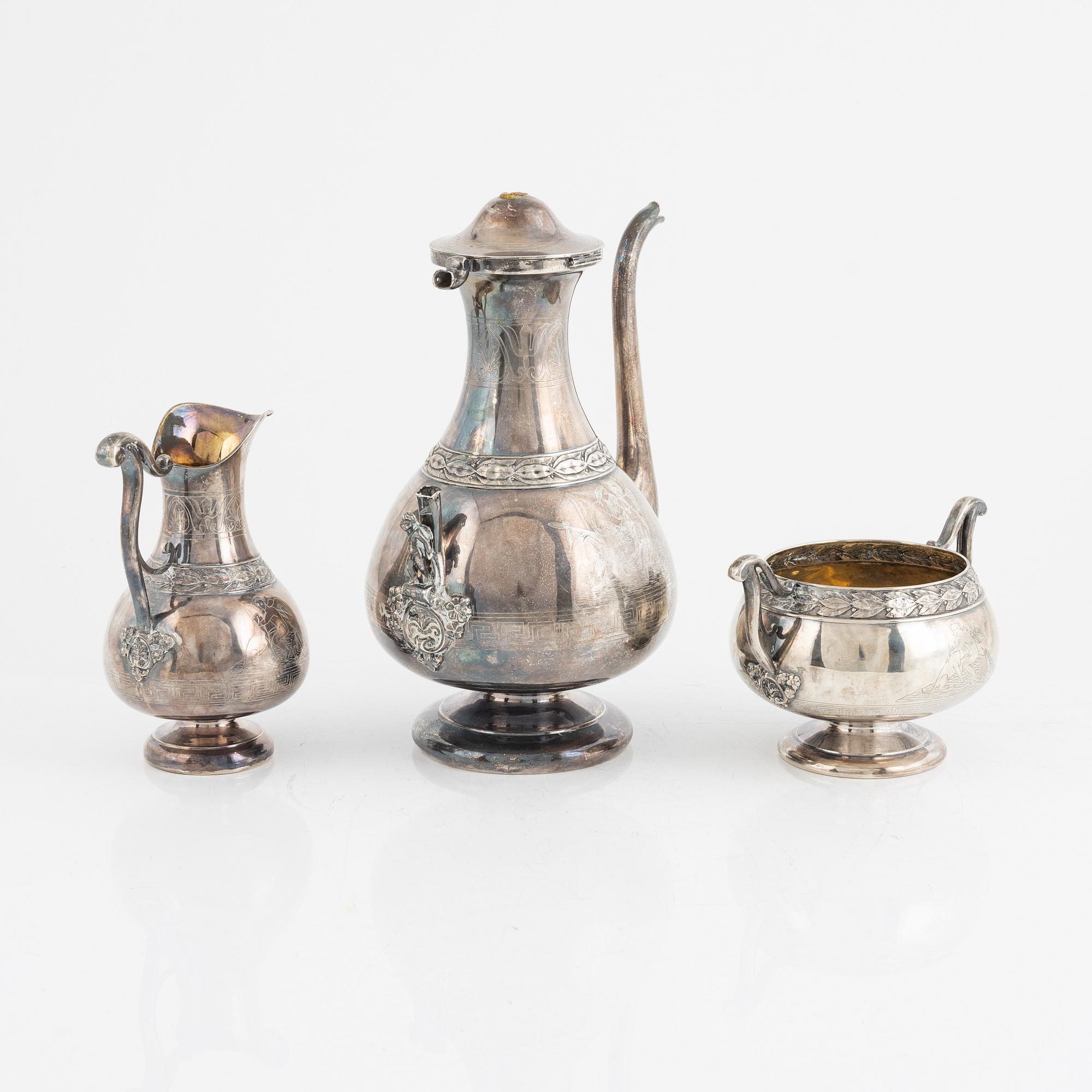 A Swedish Silver Coffee Pot, Creamer and Sugar Bowl, marks of GAB, Stockholm 1875-1897, and GT Folcker 1875.