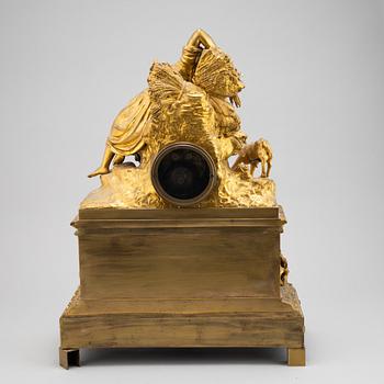 A mid 19th Century brass and gilt brass mantel clock.