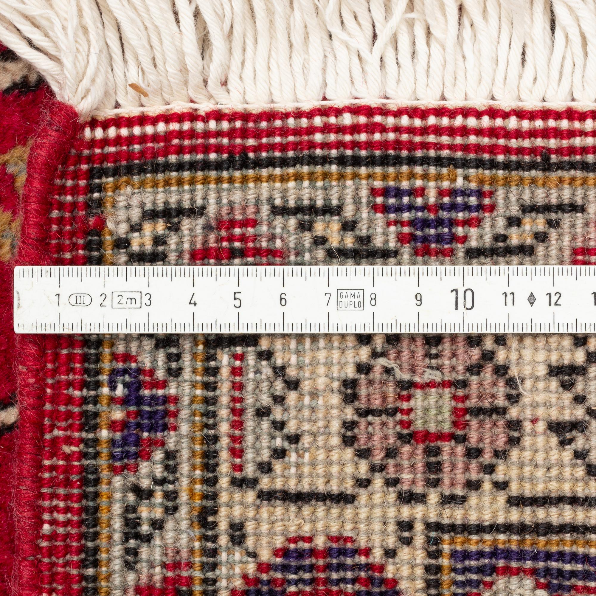 A carpet, west Persian, ca 303 c 203 cm.