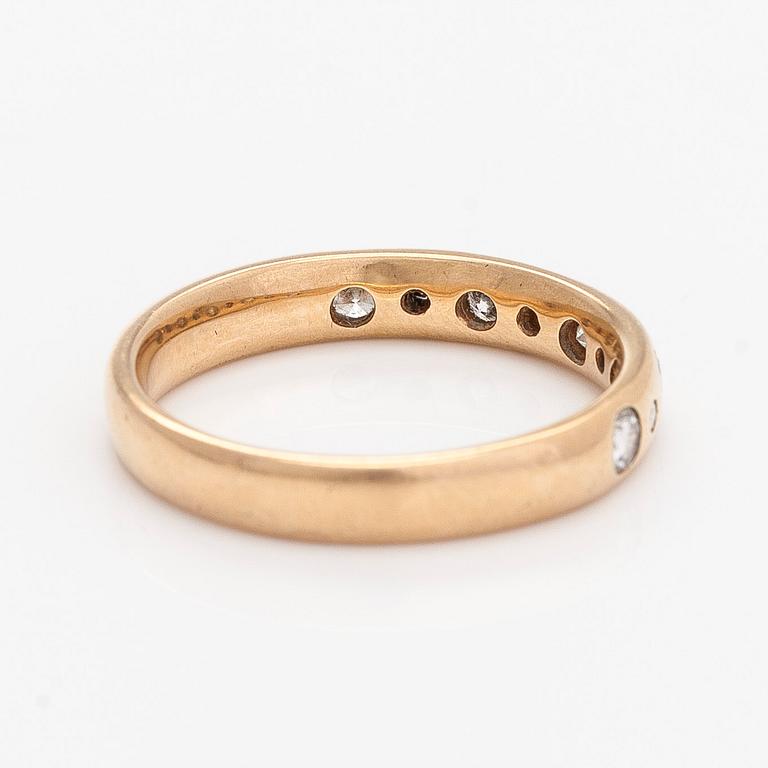 A 14K gold half eternity ring, set with brilliant-cut diamonds, total approximately 0.26 ct. Timanttiset, Helsinki 1997.