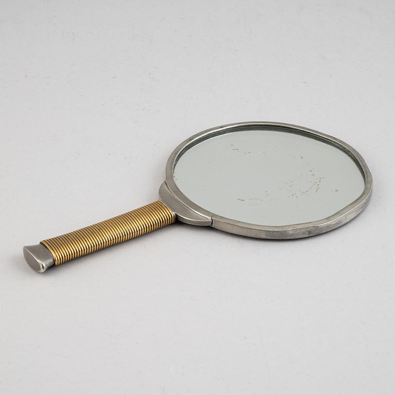 A pewter and brass hand mirror, Svenskt Tenn, 1930's.