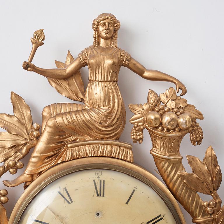 A Swedish Empire wall clock by G Undén.