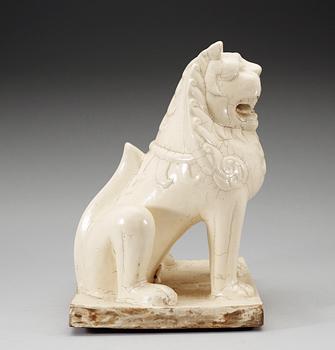 A large white glazed figure of a 'Buddhistic Lion', Qing dynasty, presumably Kangxi (1662-1722).