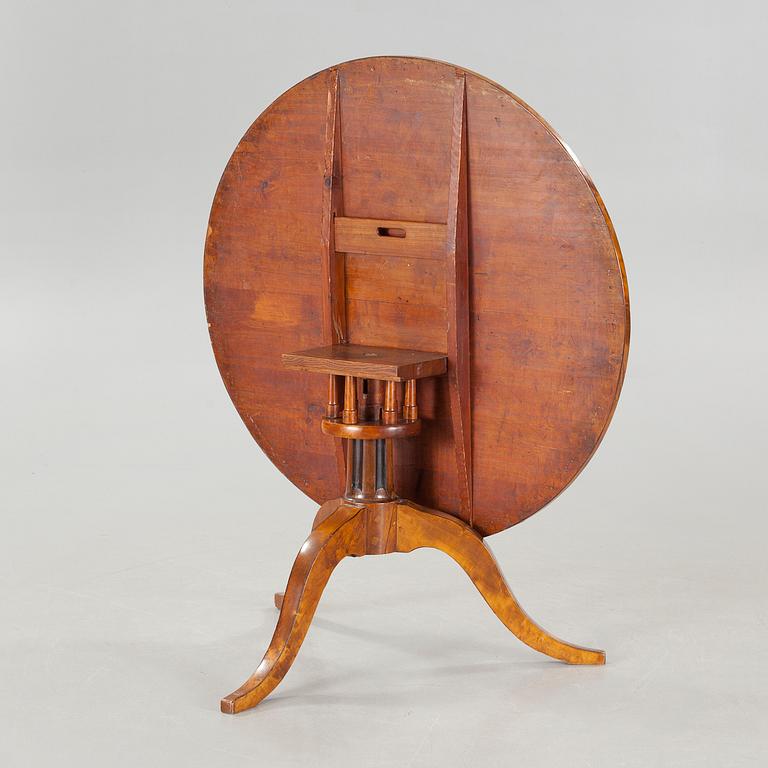 A 19th century drop-leaf table.